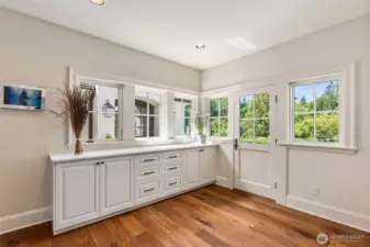 Elegant mudroom perfectly situated between the two wings of the home.