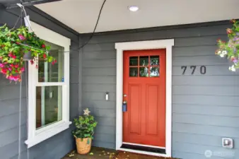 Welcome home! This covered porch wraps all the way around to the back for amazing views!