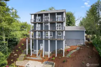 Here's the back of the house.  Landscaping has been done with all the hardscape, stairs and patio.