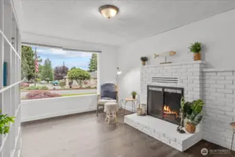 Front living space with light drenched picture window, fireplace (can be wood or gas ( needs insert), and custom built in bookshelf.