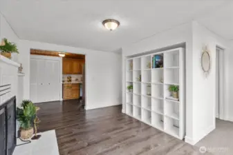 Front living area showing built in bookcase and walk-thru mudroom to the right.