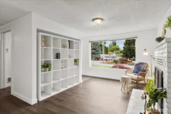 View of Front living area, walk thru mudroom/coatroom and built in bookshelf.