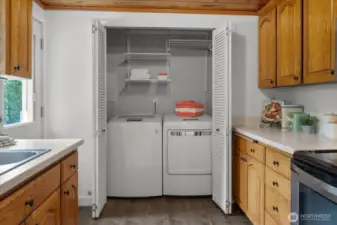 Convenient Laundry Area Closes away when not in use.