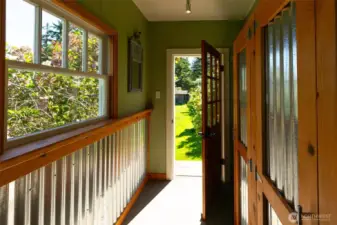 Updated farmhouse chic back porch for those days out in the garden.