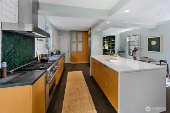 The center island creates definition of space in an elegant and thoughtful way.