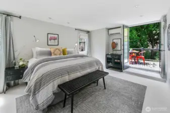 The primary bedroom is en-suite and features a roof deck with views.