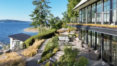 Crafted with steel-beam construction, the home features cantilevered decks that create striking lines while shading the main-level porch.