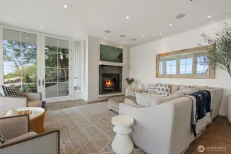 At the heart of the living room, a Town & Country propane fireplace combines modern design with warmth and comfort.