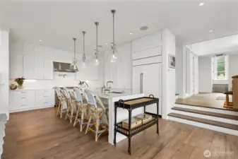 A sightline to the kitchen is balanced by the spacious breezeway entry on the right, creating a sense of flow and openness.
