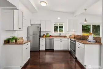 This kitchen is made with storage, work zones and entertaining in mind - so perfect! The laundry room is right off the kitchen.