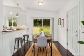 Dining with a backyard view!  Slider to the zero-step deck and out to the garage on the right.