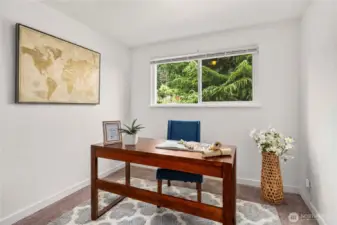 First bedroom styled as home office space. Perfect for baby's crib, twin, or full bed set.