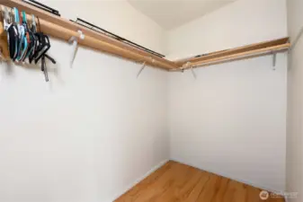 Primary bedroom walk in closet