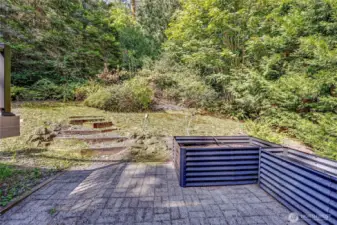 Back yard with raised garden beds
