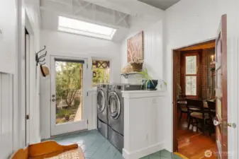 The East entrance. Informal and 'homey'. A 3/4 bath on one side and the laundry on the other. The dining room servers entrance is shown to the right.
