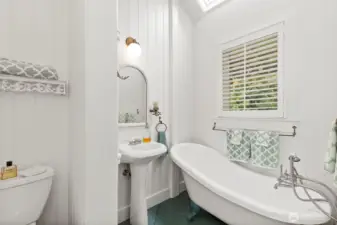 3/4 bath on the main level, just off the kitchen. Modern, but with a classic feel that is perfectly executed and befitting the home.