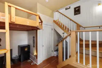 The corner room which is home to a childrens loft as well as the stairway to the 3rd floor living space bedroom. This room would be an ideal spot for guests and visitors.