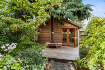 Nestled out back, behind some bushes and under a large tree sits The Studio! This is an extremely special space, away from the rest of the home and invisible to anyone not looking for it. It is the ideal space for so many things! indoor/outdoor yoga, office, gues quarters, playroom... it's more than a simple 'outbuilding', it's a destination all unto itself.