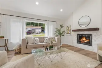 Living room with fireplace and large windows