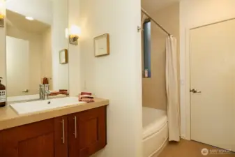 2nd floor full bathroom with ceramic tile flooring & shower surround.