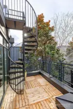 Spiral staircase to roof top deck