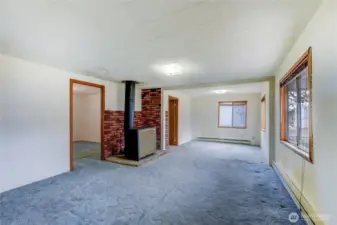 Living room area with wood stove.