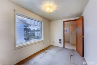 Dining area leads to laundry room and back door to covered porch.