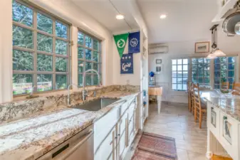 Kitchen sink area with views of deck and garden