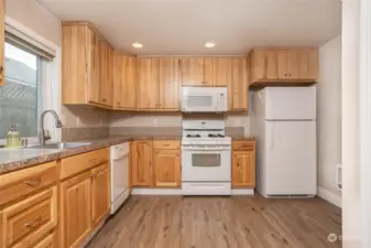 Unit C- Ample hickory cabinets in kitchen