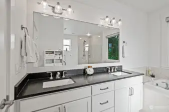 Dual vanities with granite countertop in all bathrooms.