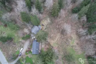 Sky View of the home on acreage with meandering creek.