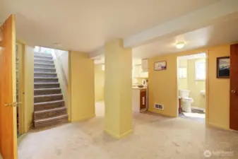Stairs from the main level to the fully finished lower level.