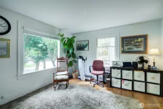 Large window in the living room looks over the front yard.