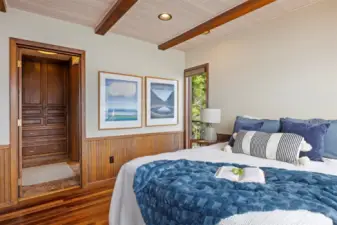 The primary suite has a walk-in closet as well as a dressing area off the 3/4 bath that has floor to ceiling built-ins on two walls.