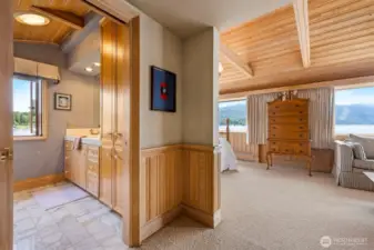 The upper bedroom suite is very spacious and has views from all rooms, including the bathroom.