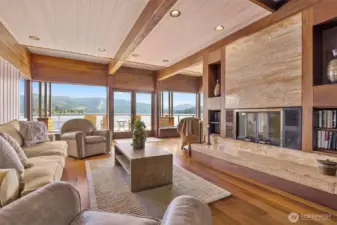 The lake level family room has a spacious family room and sitting area. This fireplace is non-functioning and could be replaced with an electric one, as the flue was removed for a remodel upstairs.