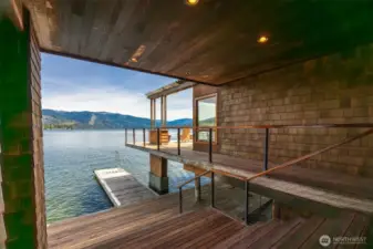 From the covered deck area one the lake level you can see the boat dock and there is abundant storage below the home, as well.