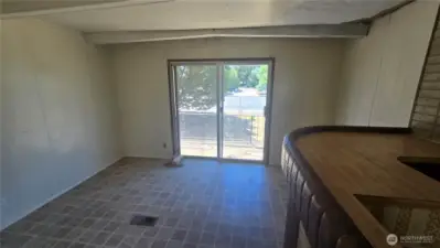 2nd living area with bar and sliding doors to exterior