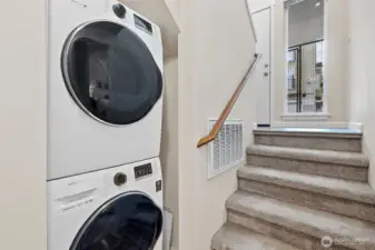 Laundry closet on lower level includes tankless hot water heater.