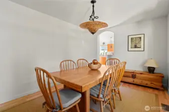Spacious dining room with Glasslight Sudio light fixture featuring hand-blown glass shade & hand-bent metal hanger!
