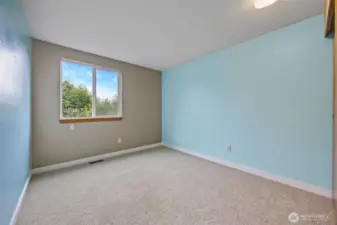 Another bedroom upstairs. One of three including the primary bedroom.