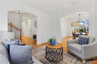 Living room opens to formal dining and entryway