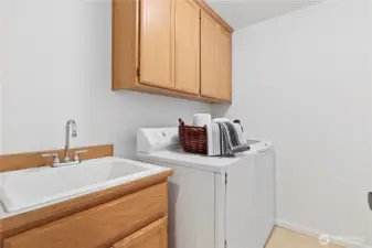 Back downstairs, the laundry is by the kitchen