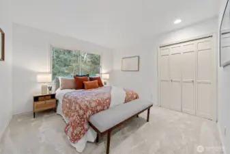 Bedroom Four features new carpeting, fresh neutral paint, generous closet storage, and abundant natural light.