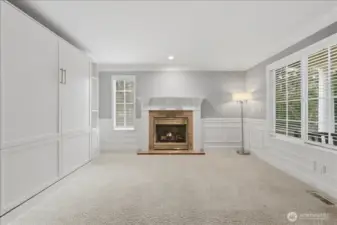 Living room or use as den/office. Built-in murphy bed on the left.
