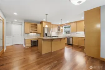 Another view of the spacious kitchen with the pantry door to the left.