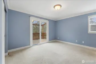 Main level MIL bedroom with outside access.