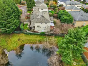 View of the east side of the home where you access the walk-in crawl space for added storage.