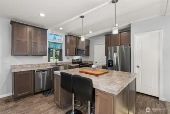 Kitchen with eat in space and island