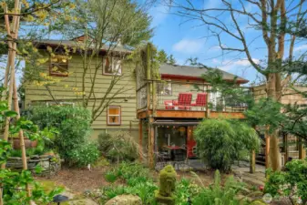 Back of home w/downstairs patio and upstairs deck